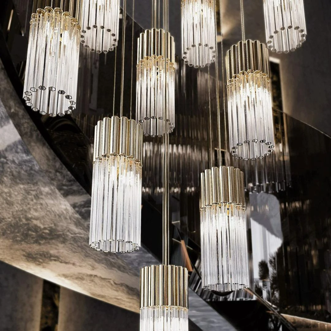 Premium multi-tiered crystal and gold staircase chandelier for luxury villas, high-end interior lighting at Ajwaad Palace, Oman.
