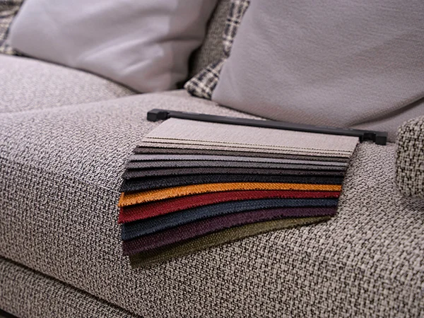 Premium luxury furniture fabric swatches for custom-made sofas and bespoke upholstery services at Ajwaad Palace showroom, Muscat, Oman.