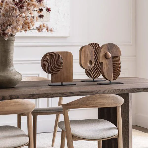 Contemporary hand-carved wooden decorative sculptures by Gardeco at Ajwaad Palace, luxury home art accessories in Muscat, Oman.
