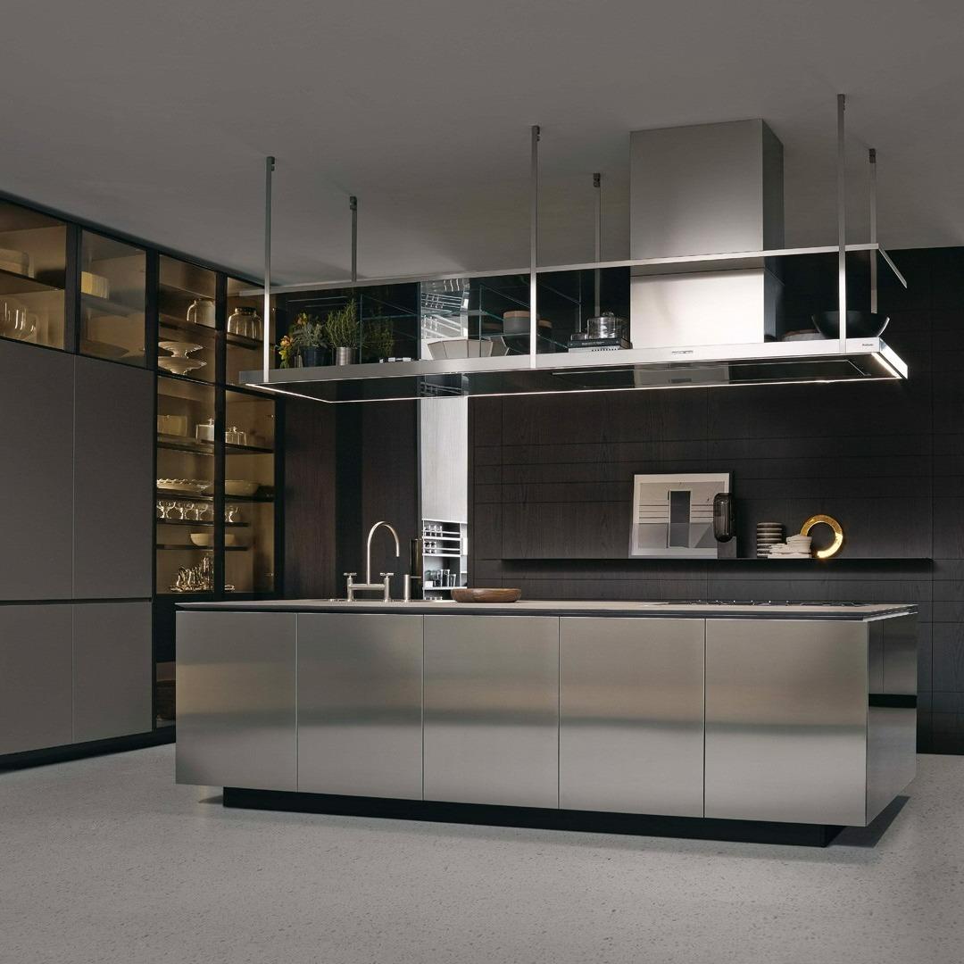 Modern minimalist stainless steel kitchen design by Qasr Al-Ajwaad, luxury furniture showroom in Muscat, Oman.
