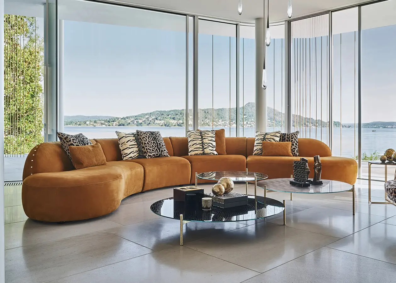 14369-RCHI_2023_WHITE-WILD_catalogue_roberto-cavalli-curved-tan-luxury-sofa-ajwaad-palace
